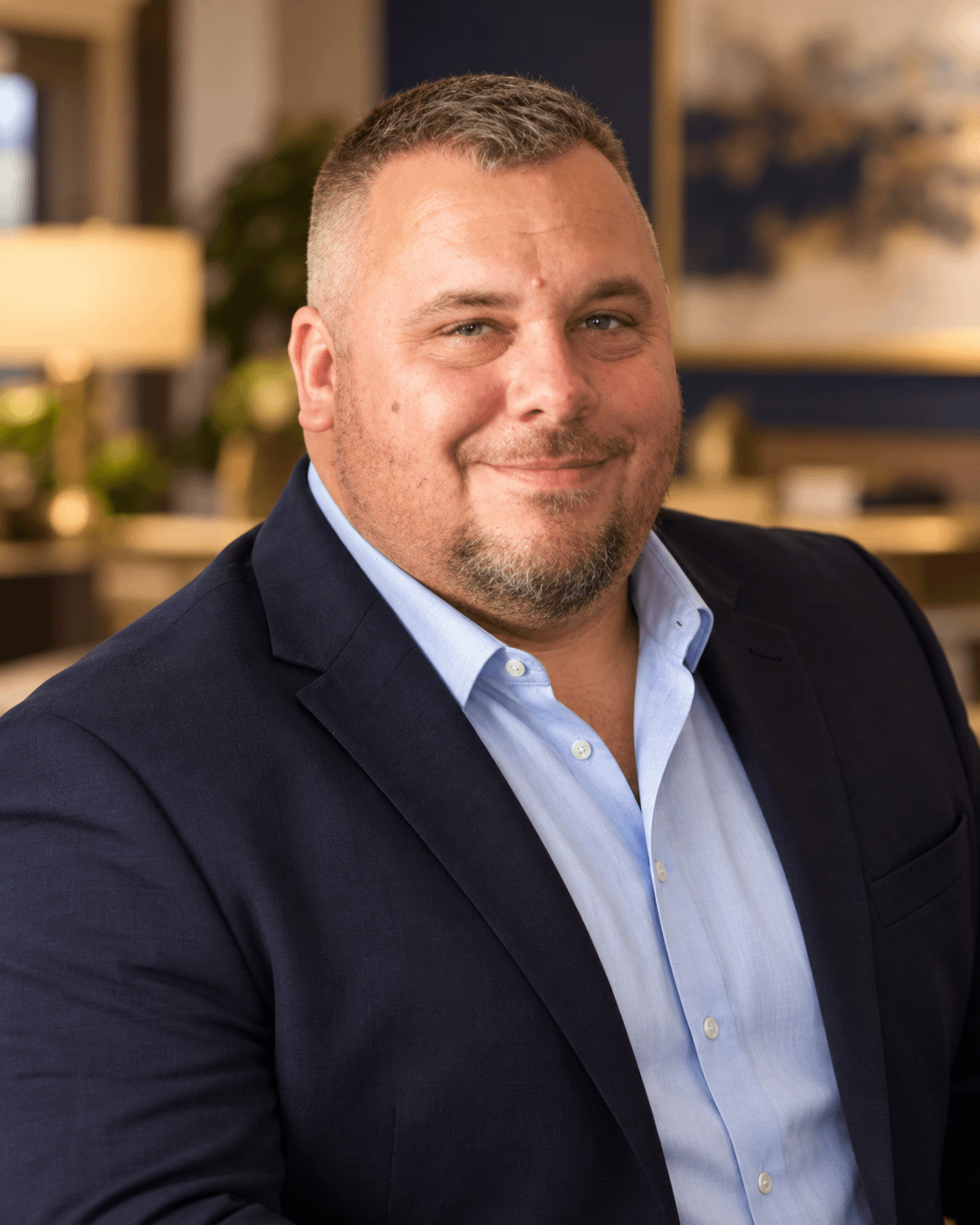 Ken Hoffmaster, REALTOR® in a navy jacket and light blue shirt